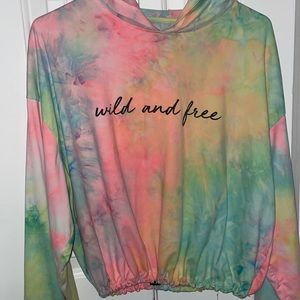 This is a long sleeve colorful shirt, it has a adjustable waist, size medium